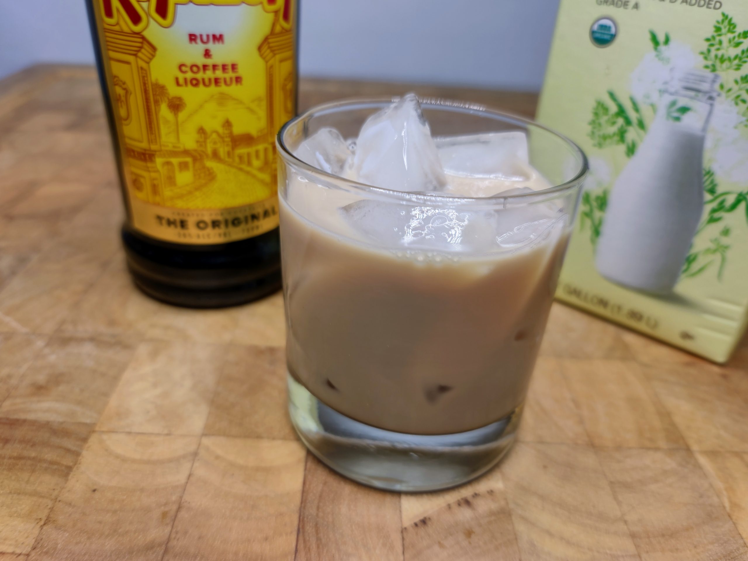 brown cow drink with kahlua and milk in background