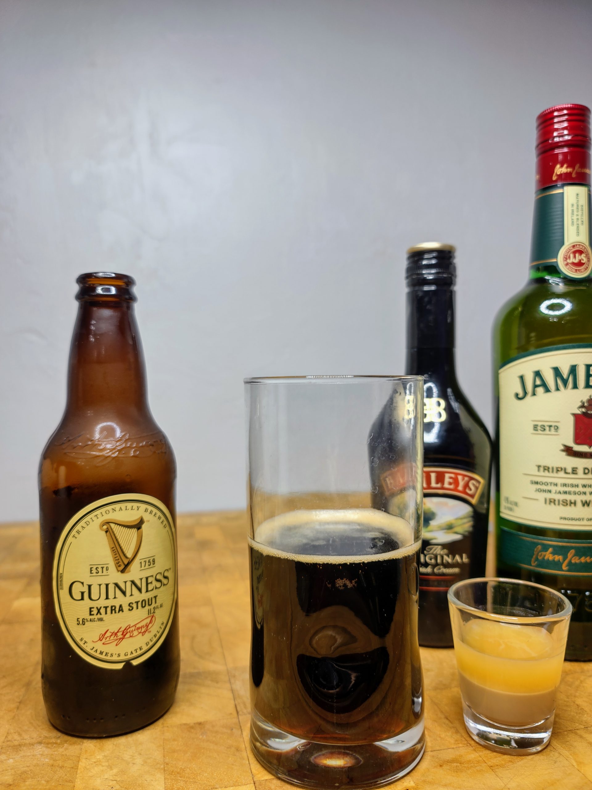 irish carbomb shot with all the ingredients behind it