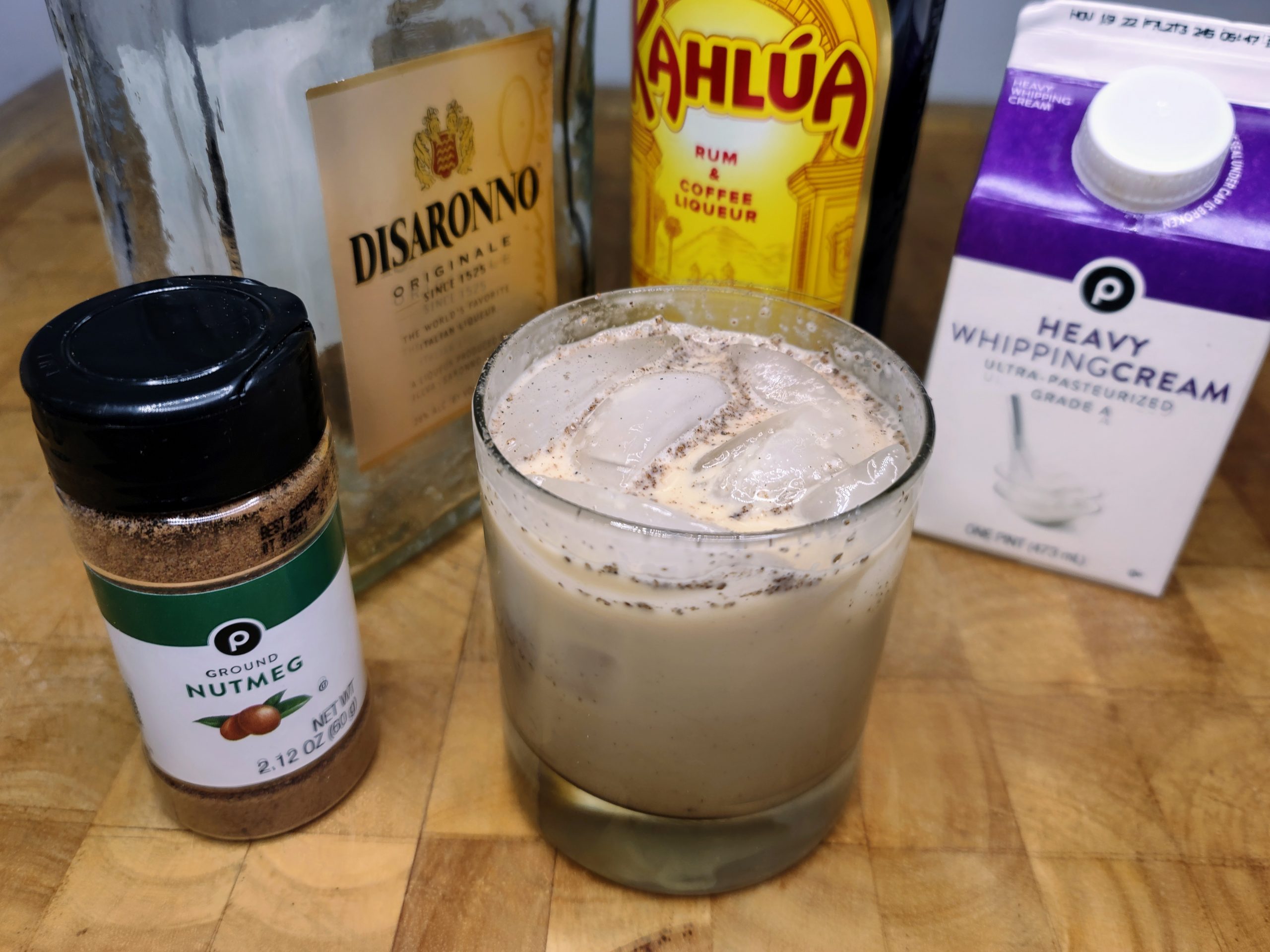 toasted almond drink with ingredients in the background