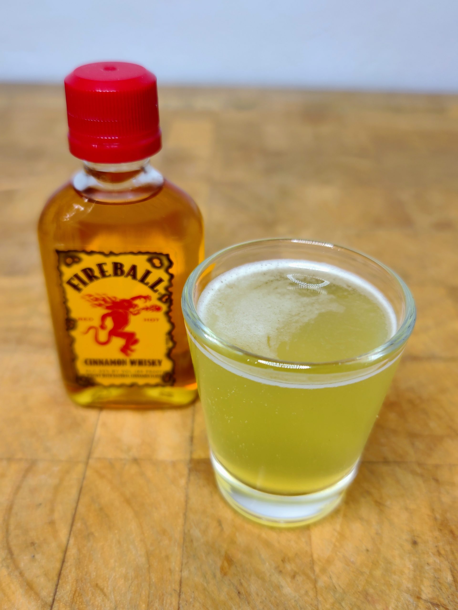 applesauce shot with bottle of fireball