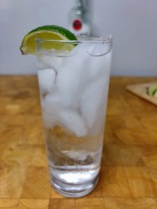 rum and soda with lime wedge