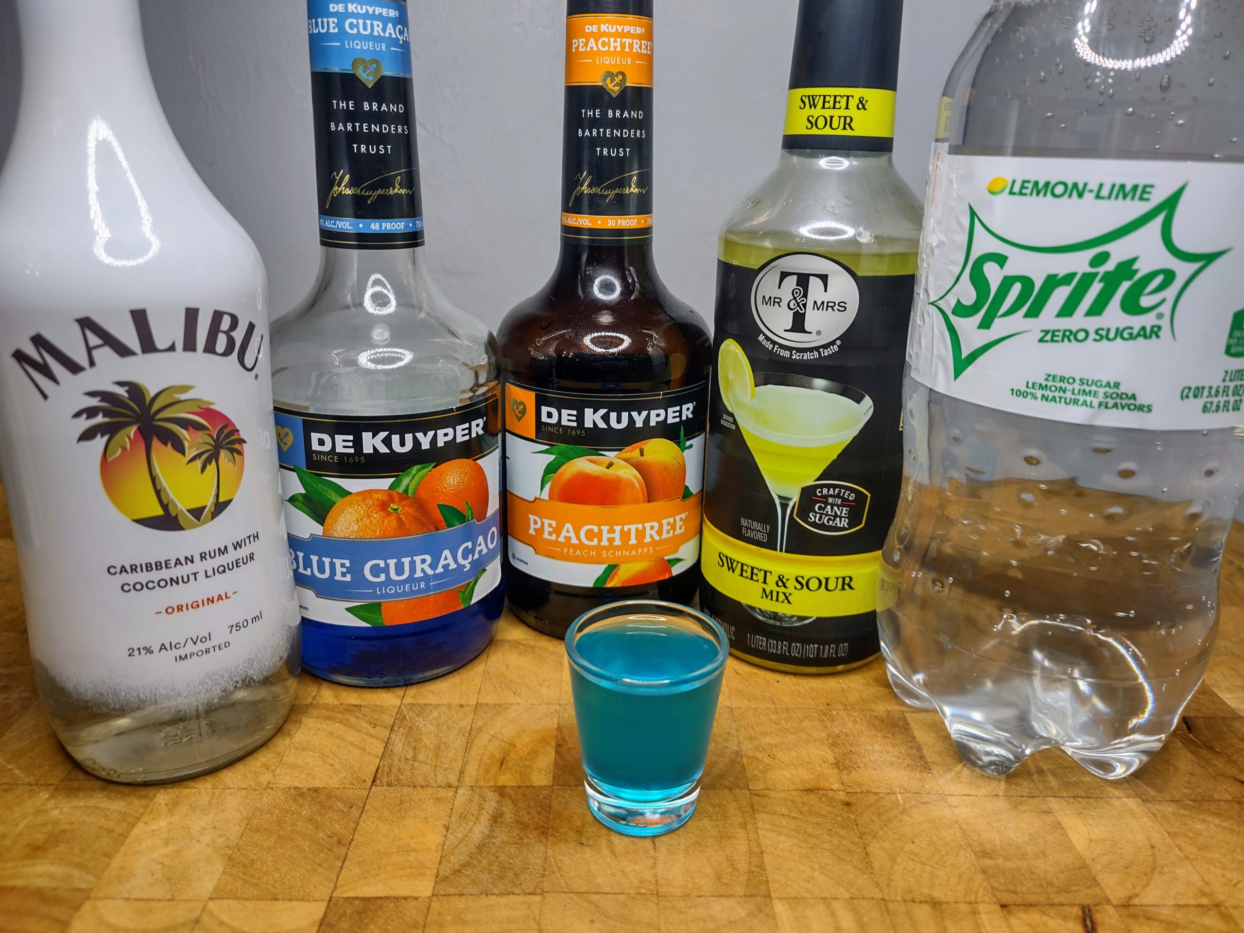 blue balls shot with all ingredients behind it