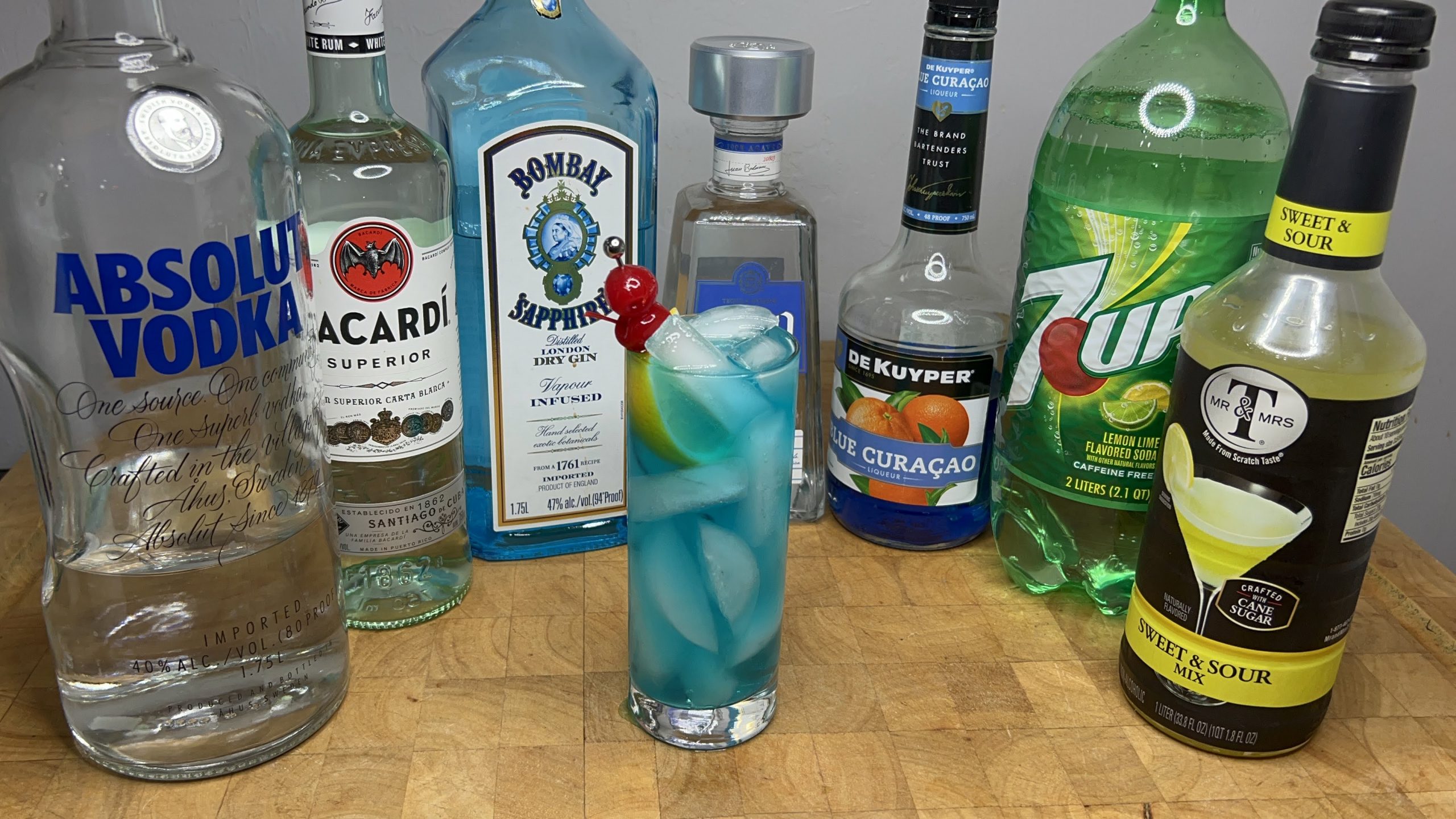 blue motherfucker cocktail surrounded by all the ingredients