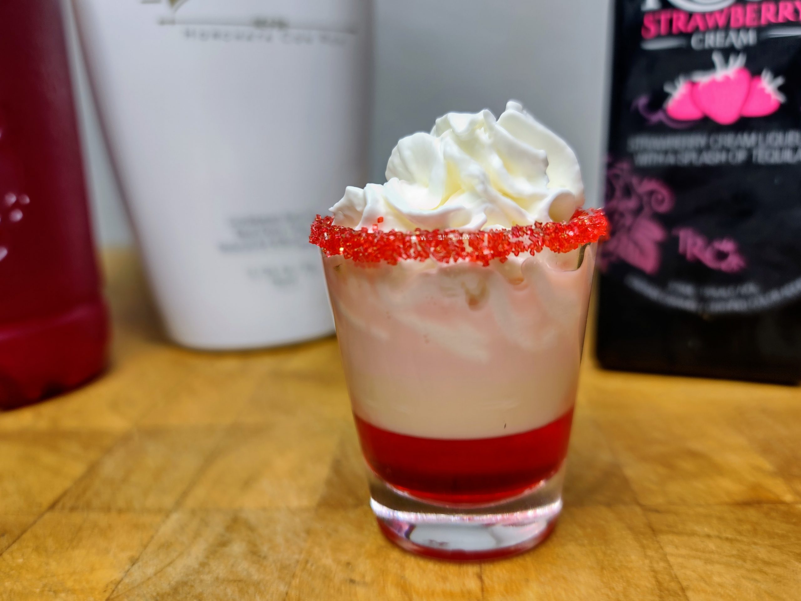 french kiss shot with ingredients around it