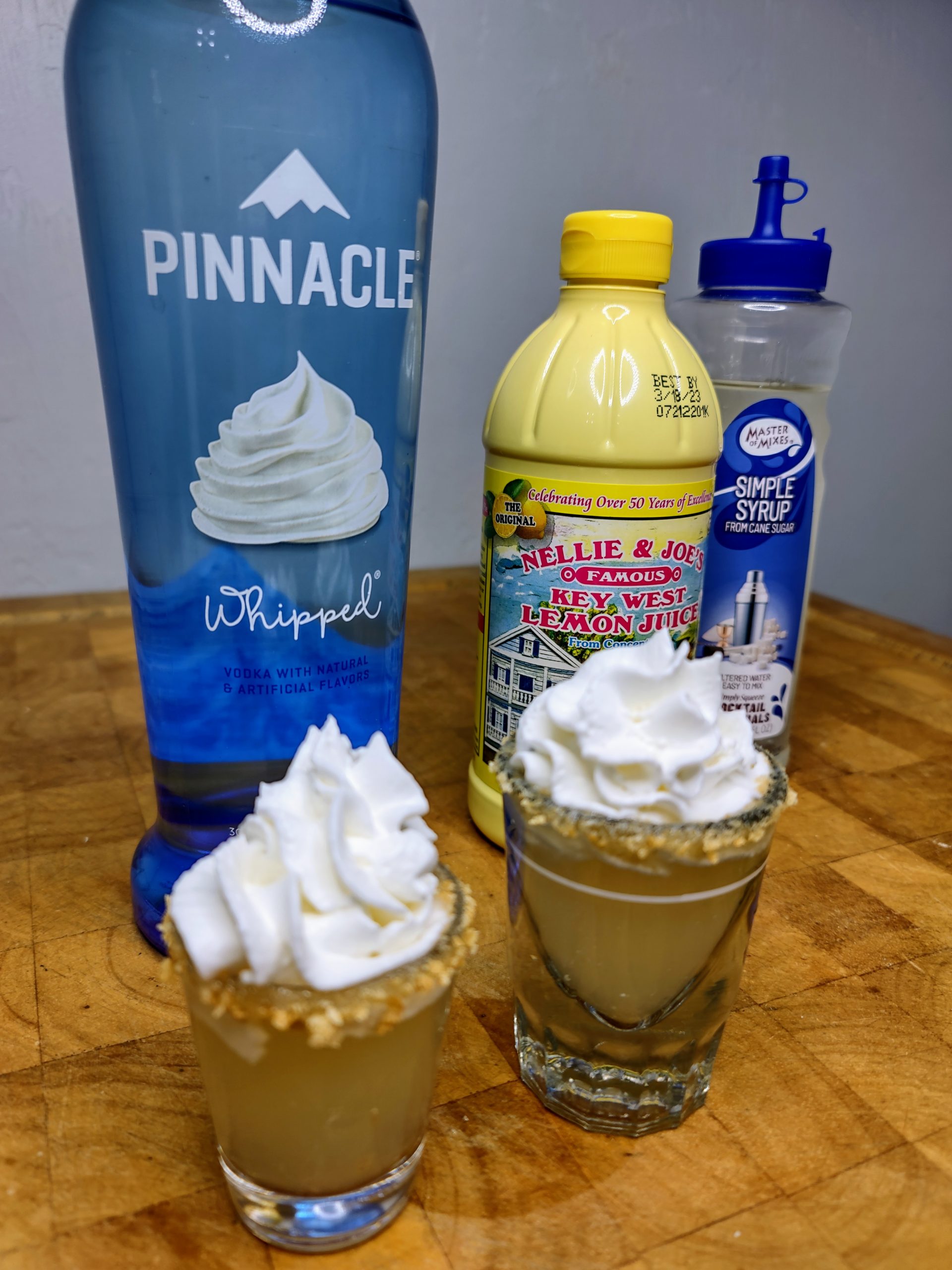 key lime pie shot with ingredients around it