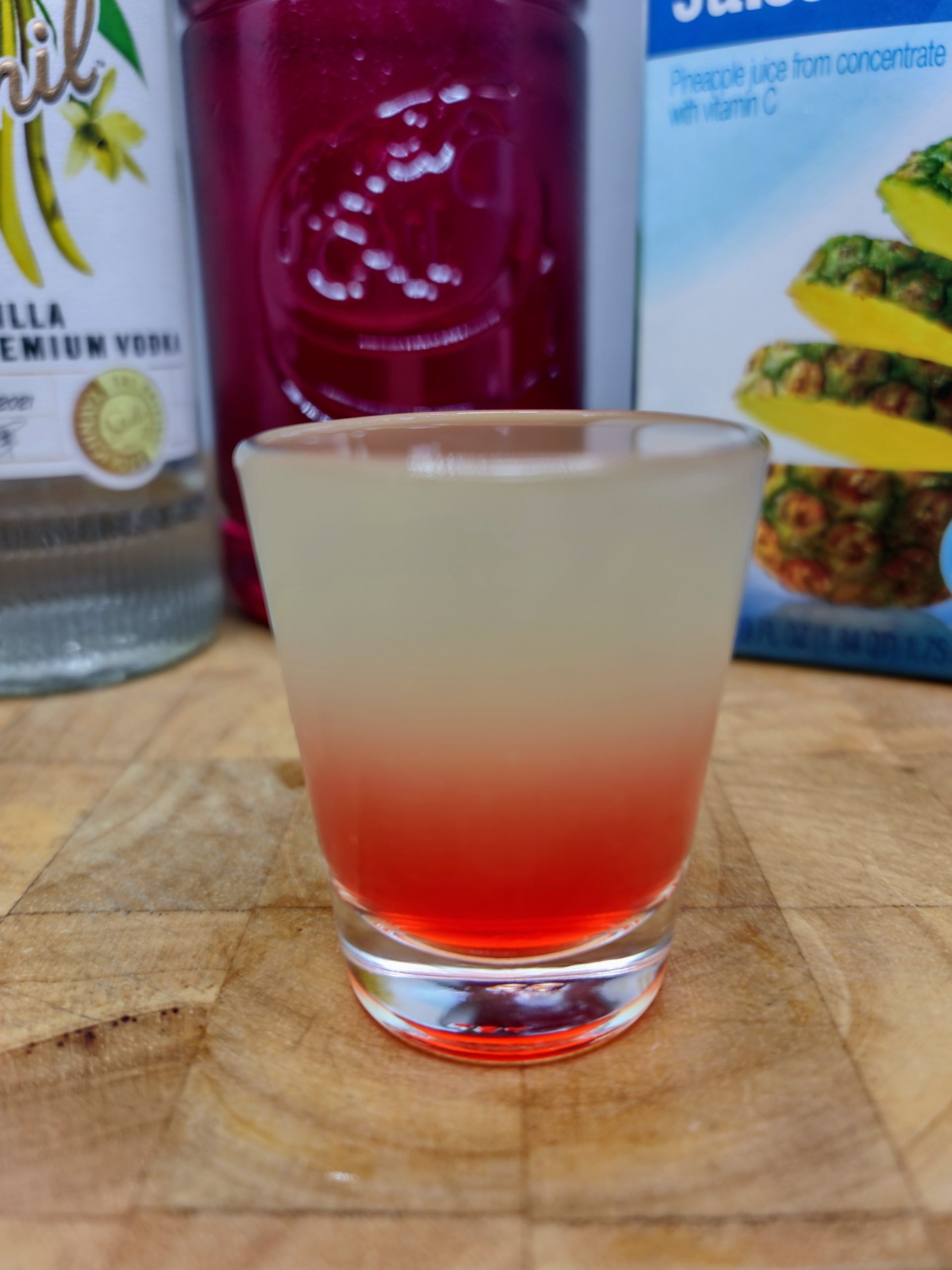 pineapple upside down shot with ingredients in background