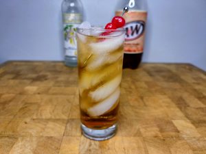 vodka and cream soda in a glass on a wooden table