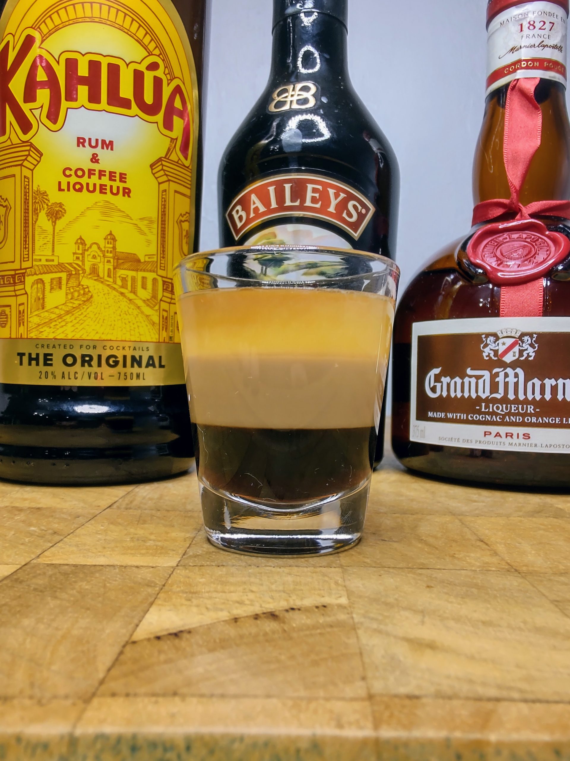 B-52 shot with ingredients behind the glass