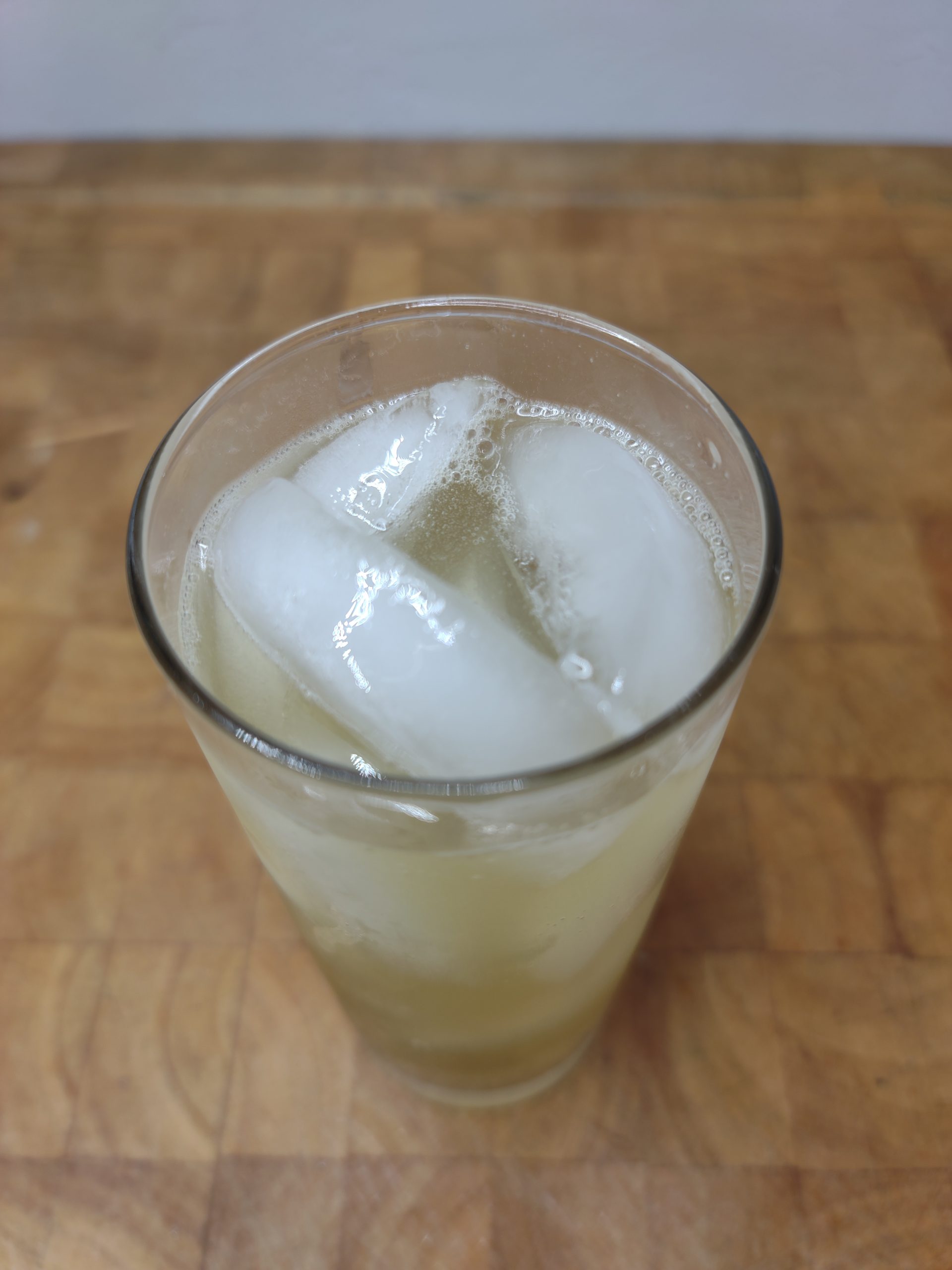 top down view of tequila and squirt soda in a highball glass