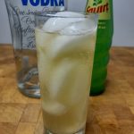 squirt with vodka in a highball with ingredients behind the glass