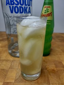squirt with vodka in a highball with ingredients behind the glass