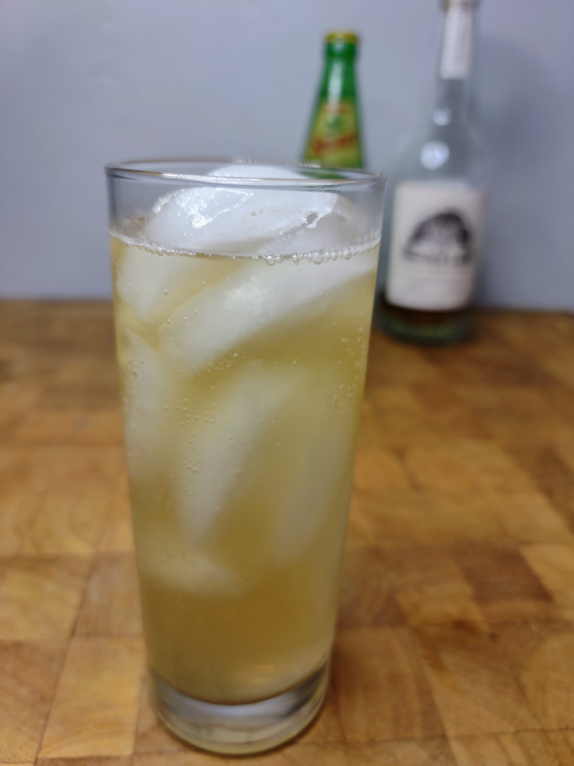 whiskey and squirt soda in a highball glass on a wooden table