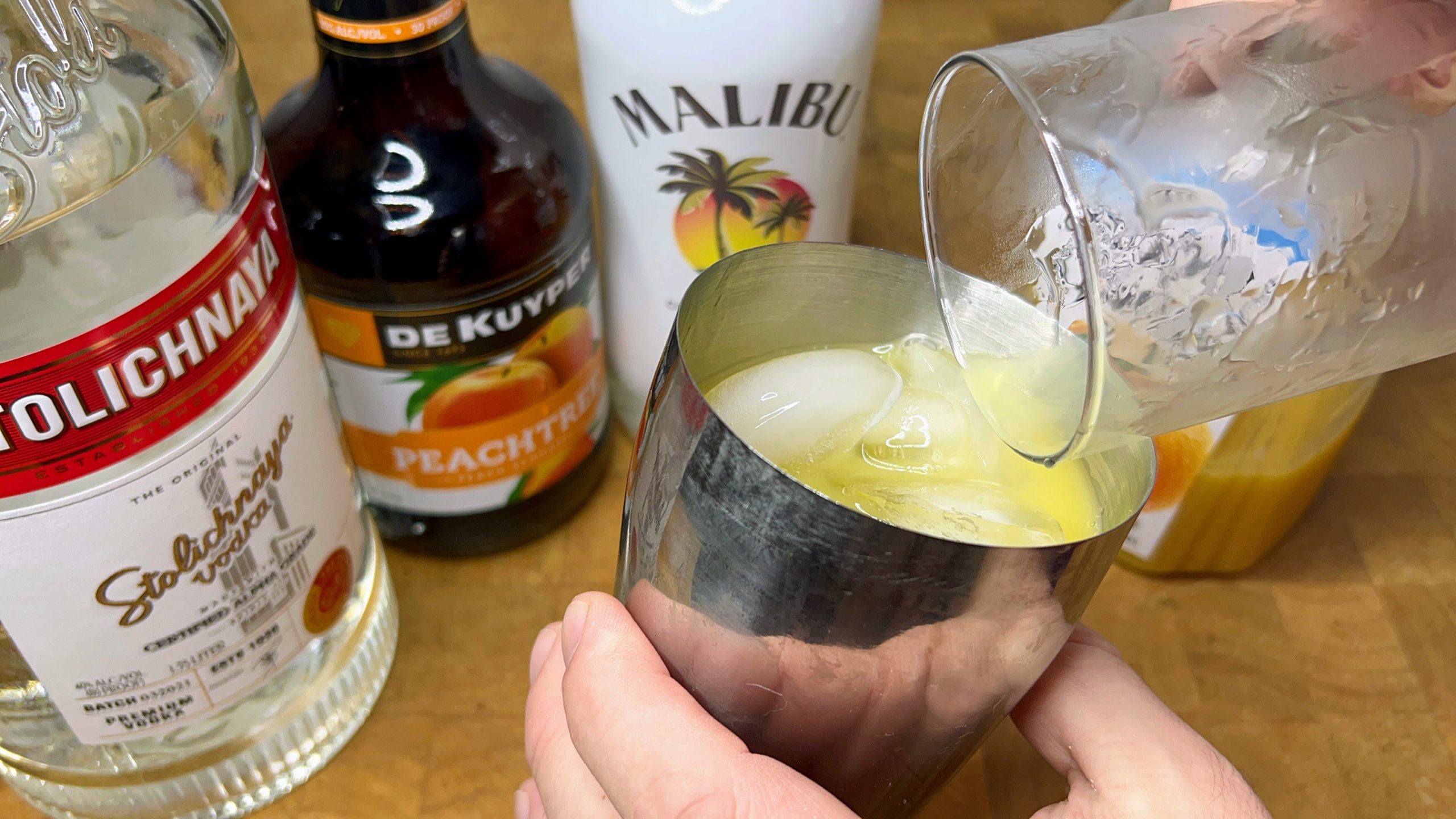 mixing the drink in  cocktail shaker