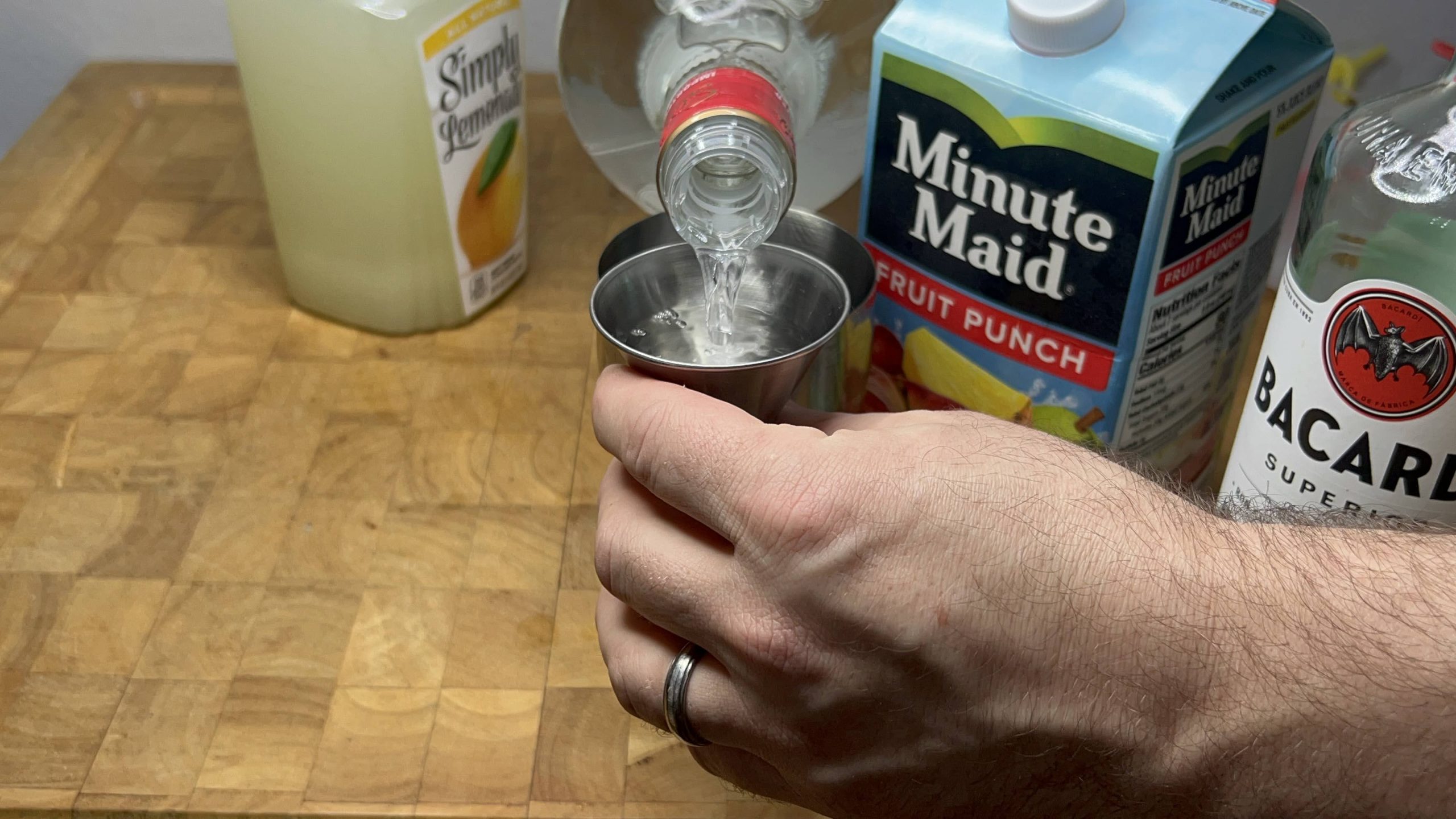 measuring vodka with a jigger