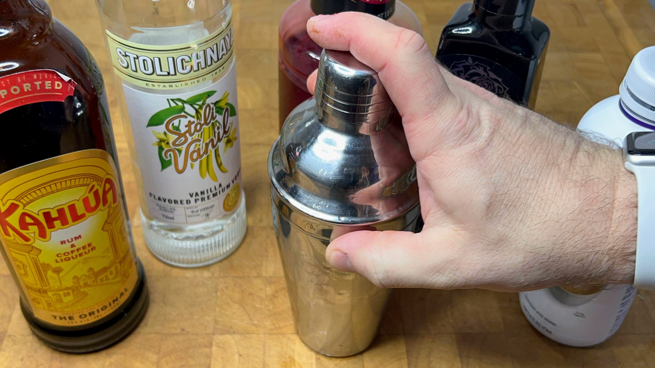 putting the top onto a cocktail shaker