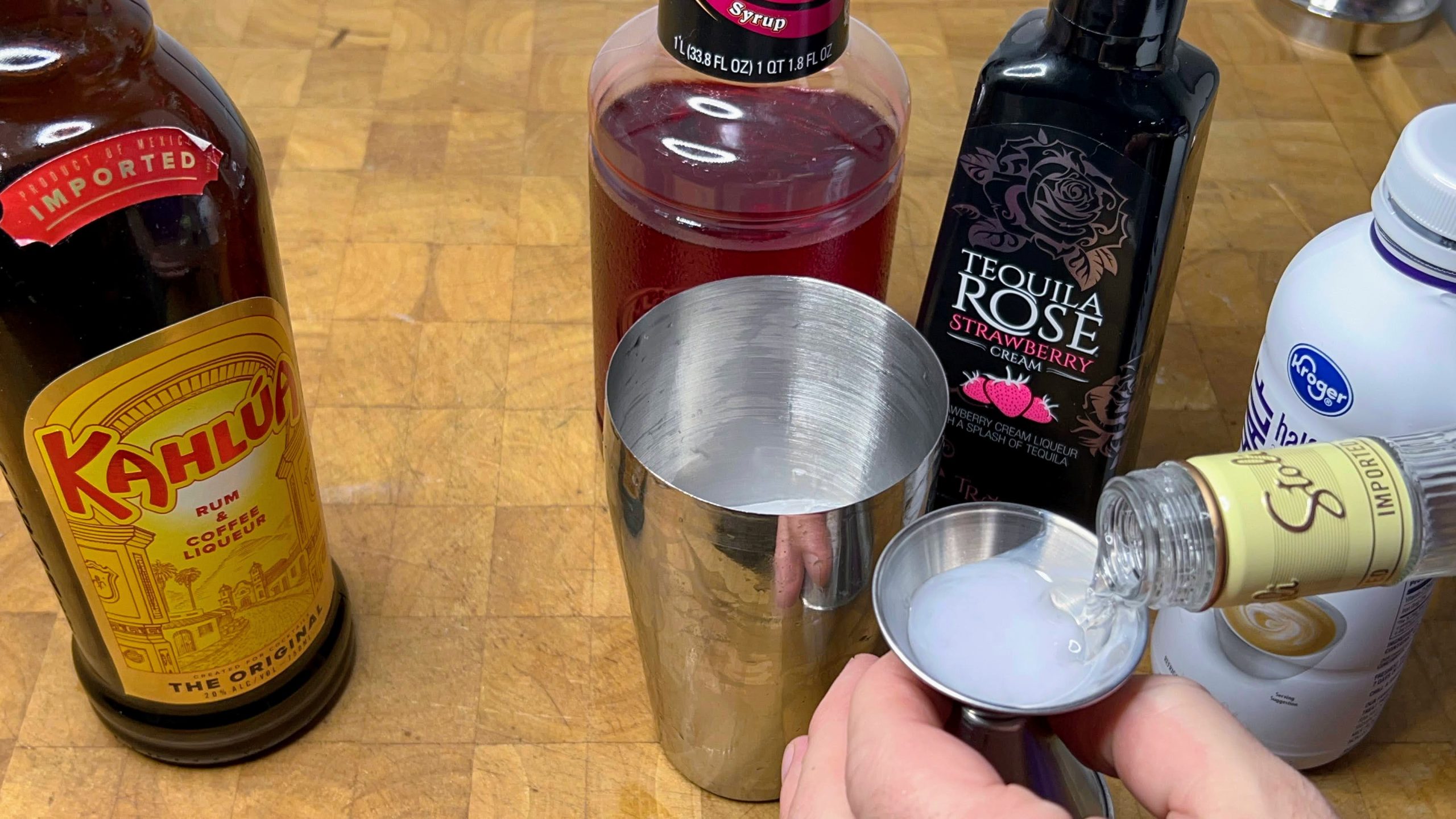 pouring vanilla vodka in a jigger