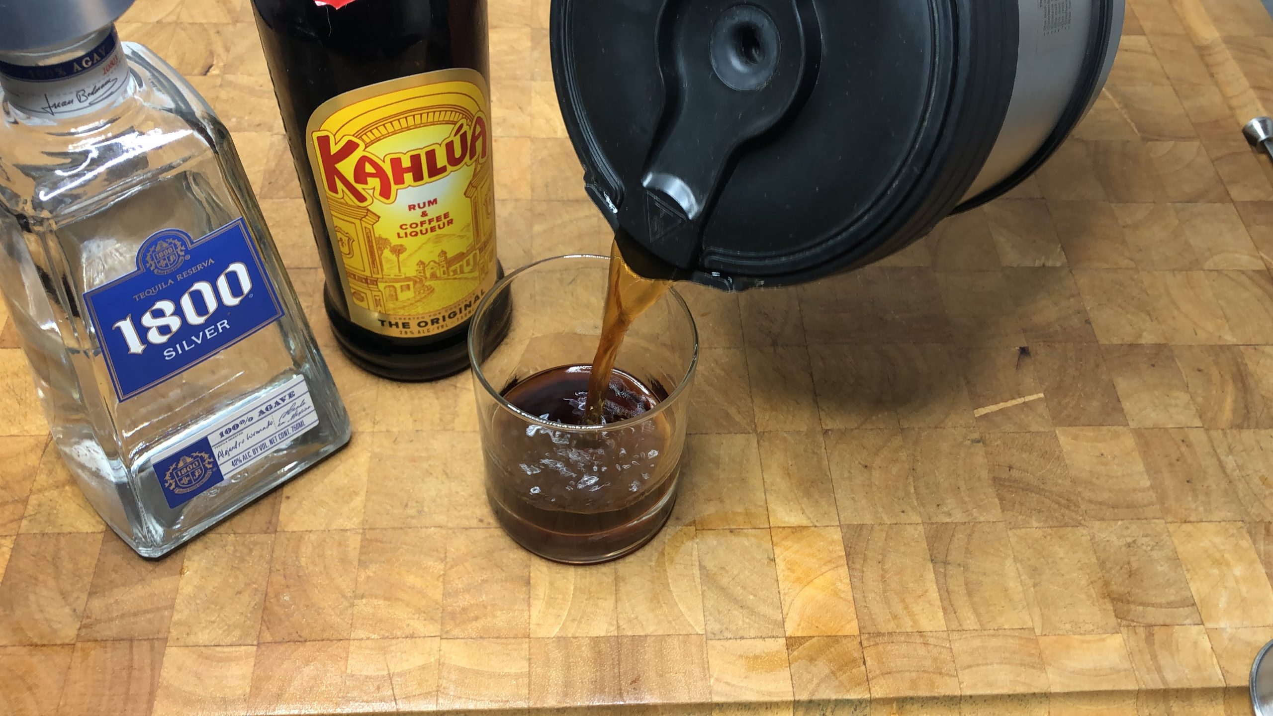 pouring coffee into a rocks glass