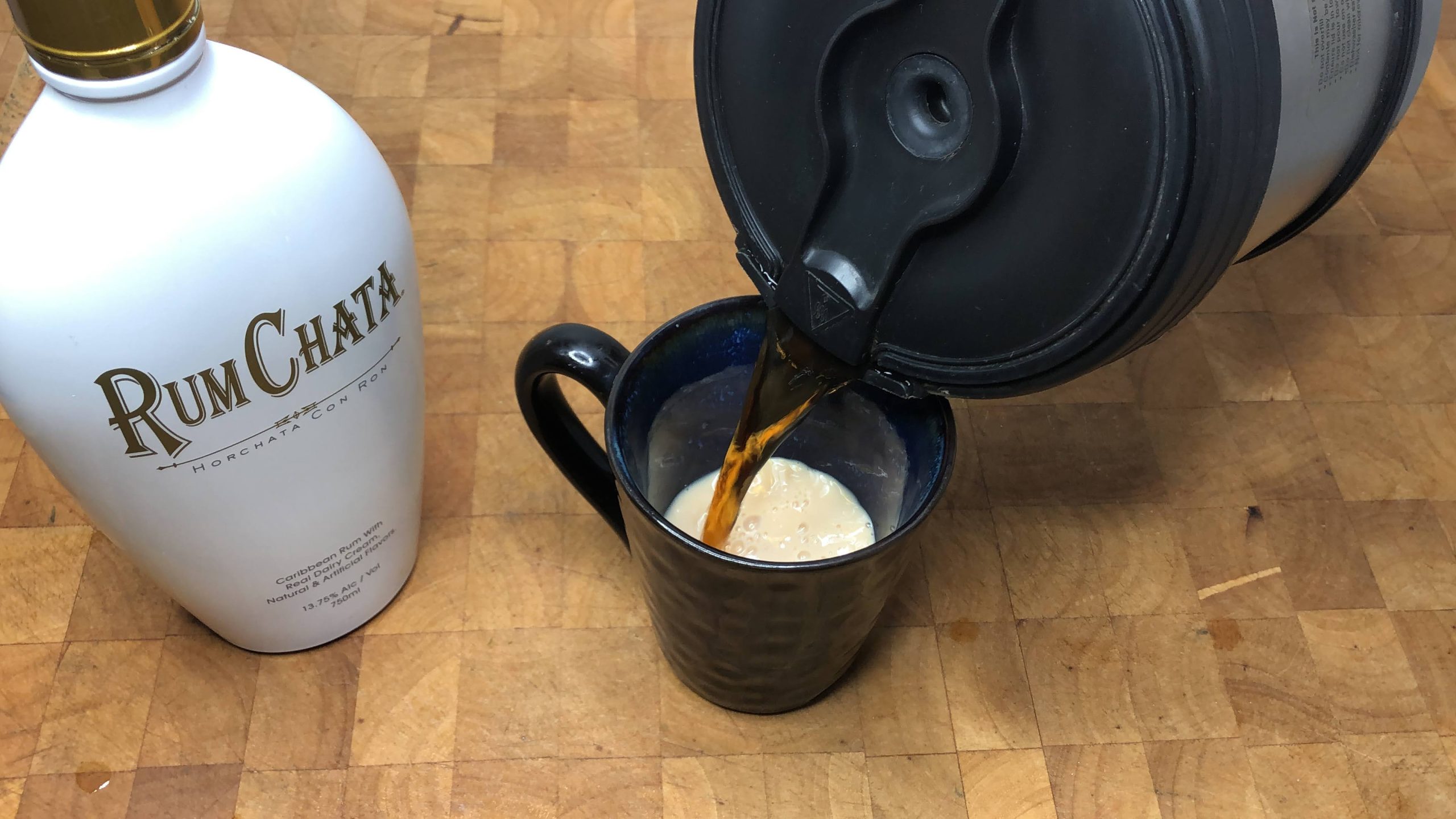 pouring coffee into a coffee mug