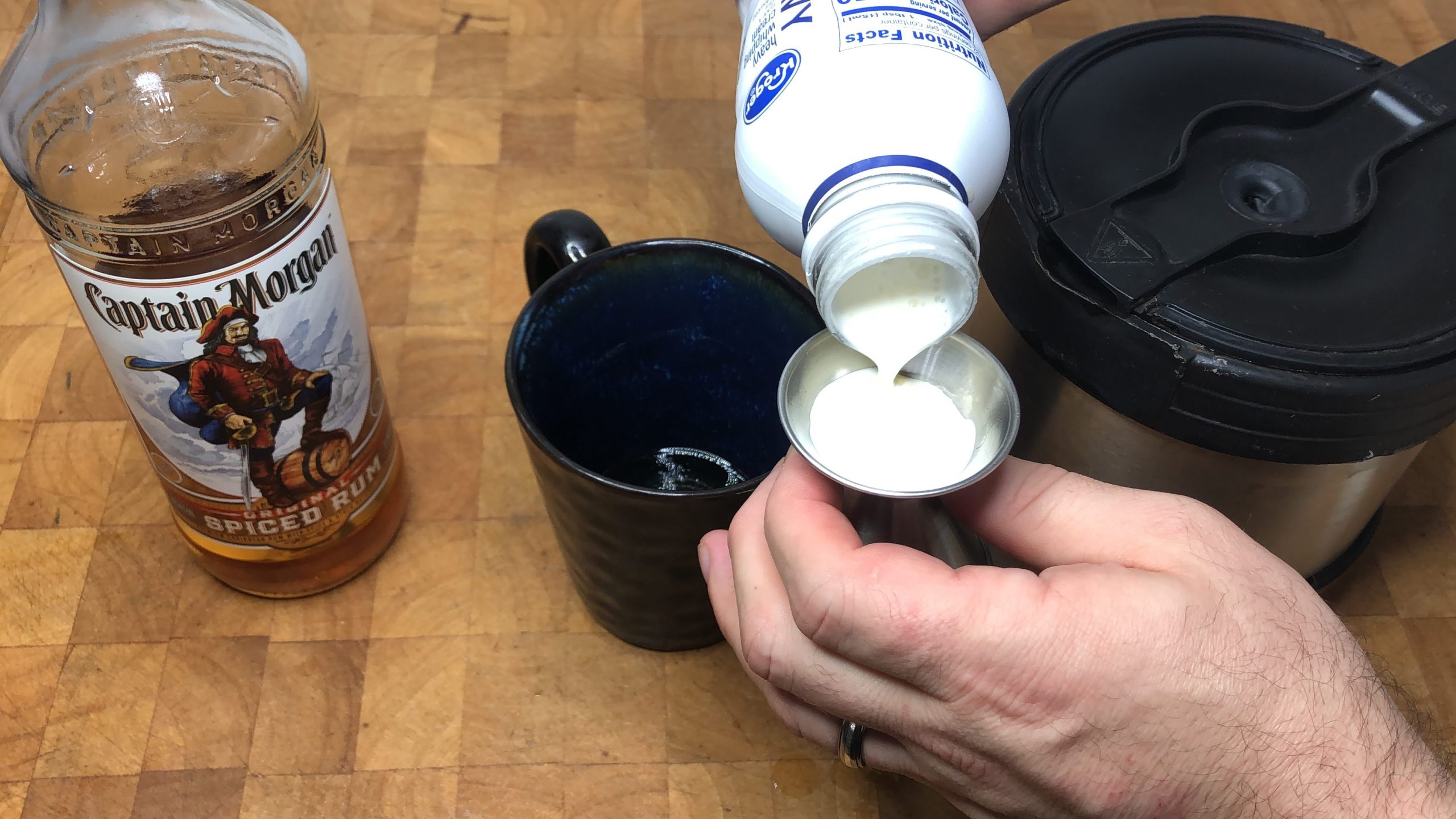 pouring heavy cream in a jigger