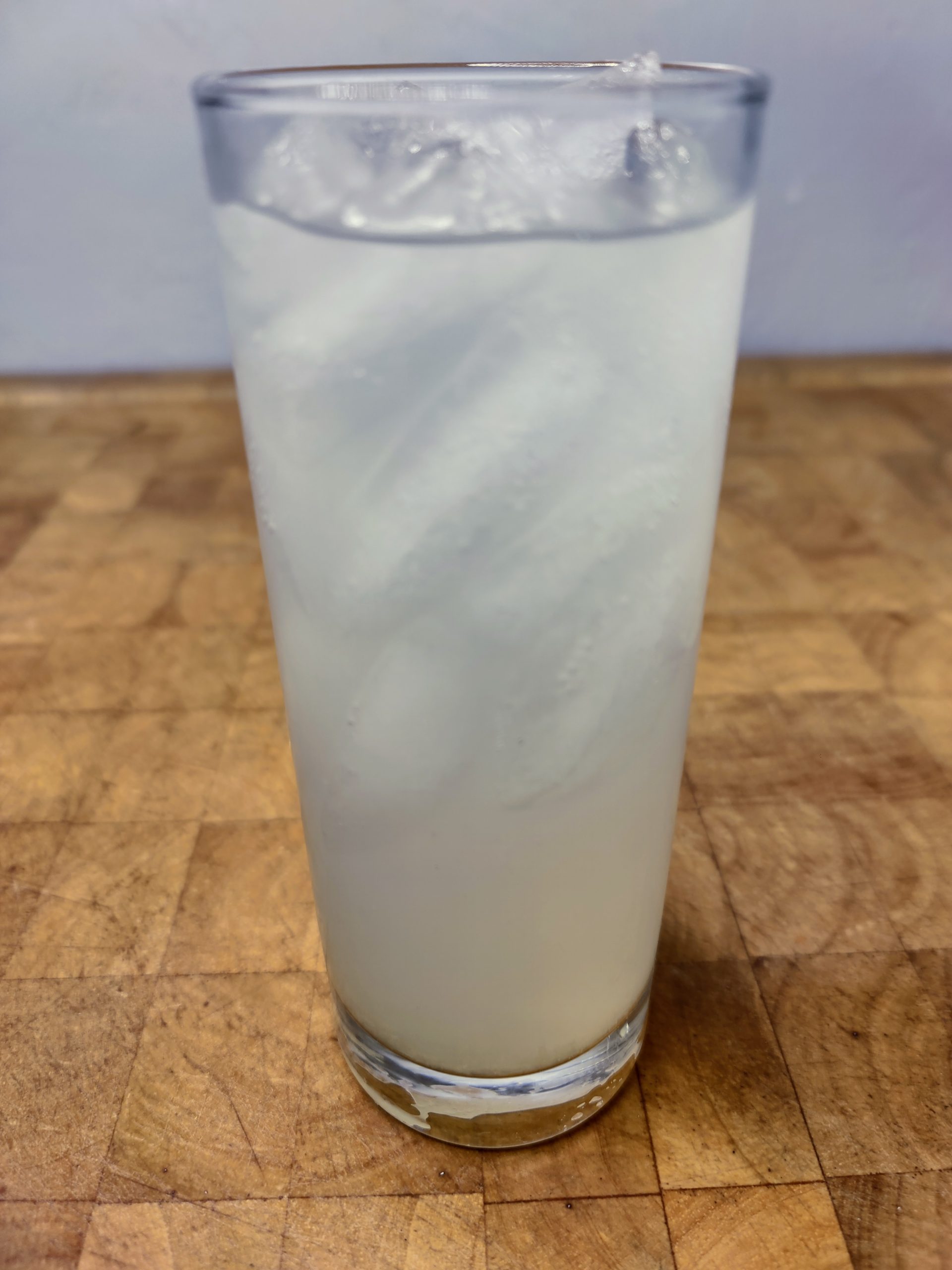 closeup of tequila limeade on a wooden table