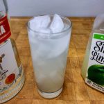 vodka and limeade in a highball glass with ingredients around the glass