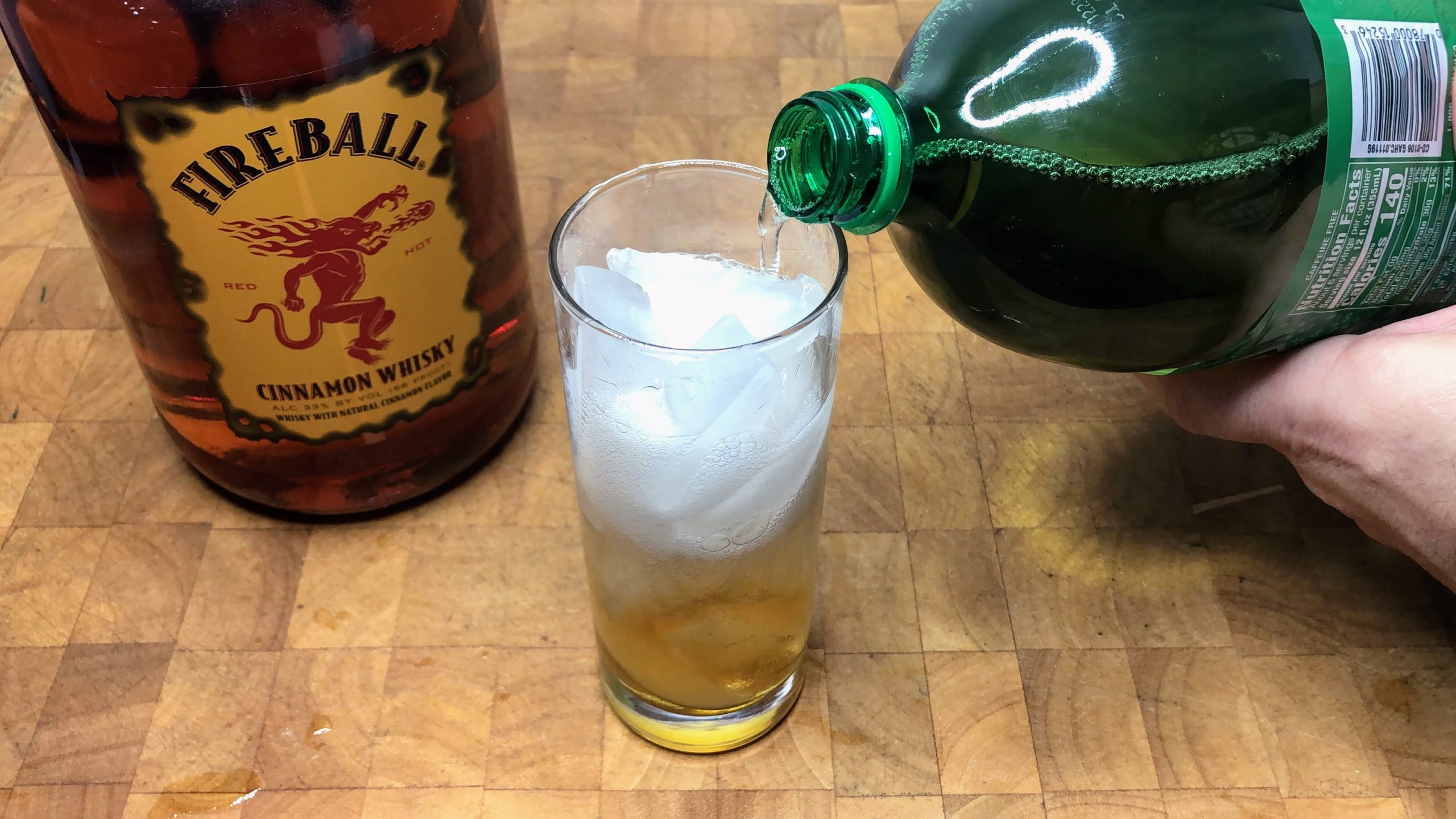 pouring ginger ale into a glass