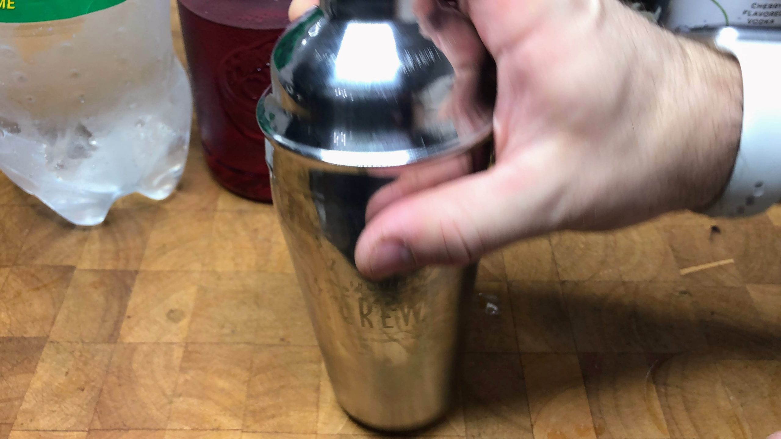 placing shaker lid on top of the shaker