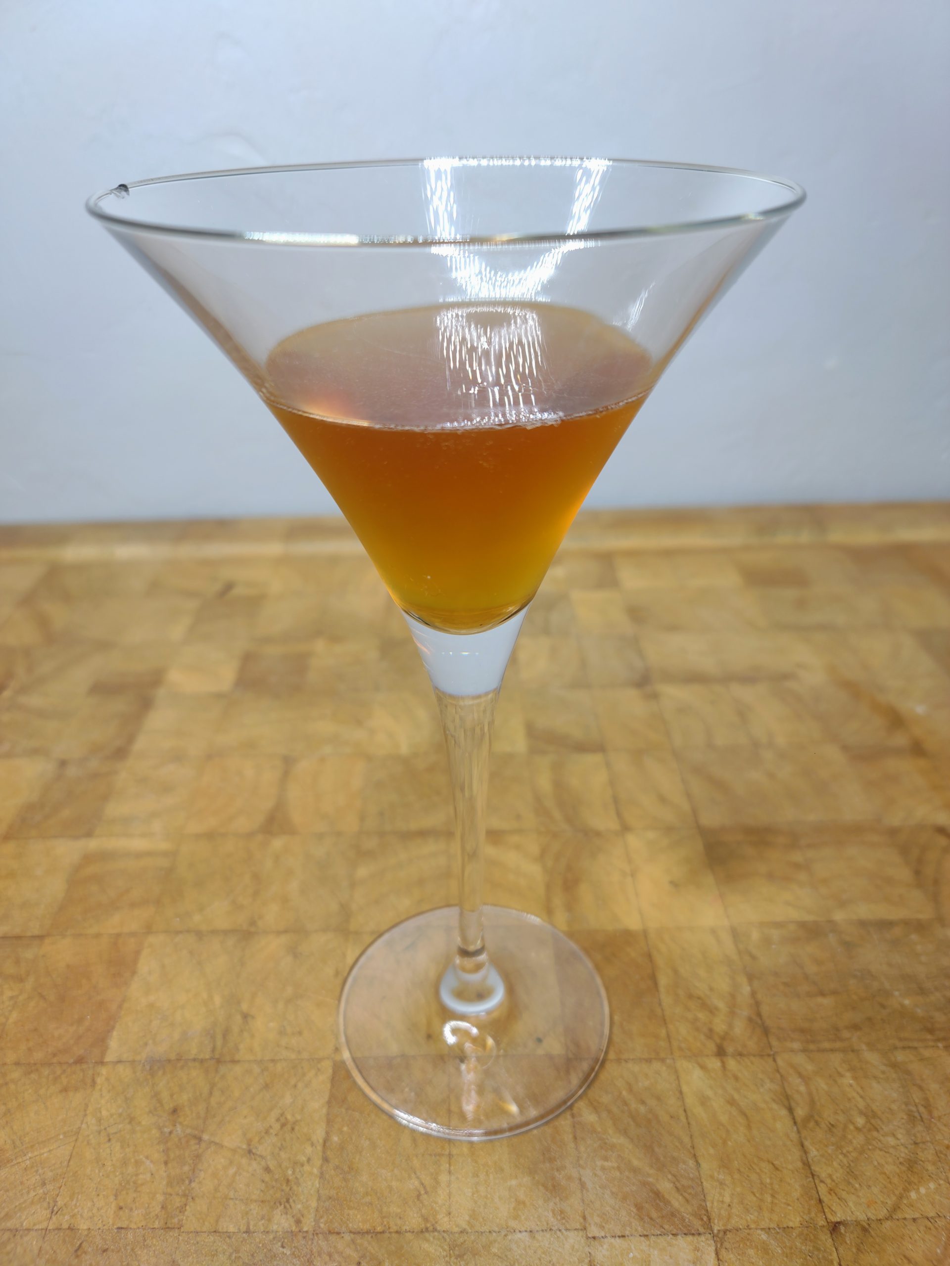 closeup of hazelnut espresso martini on a wooden table