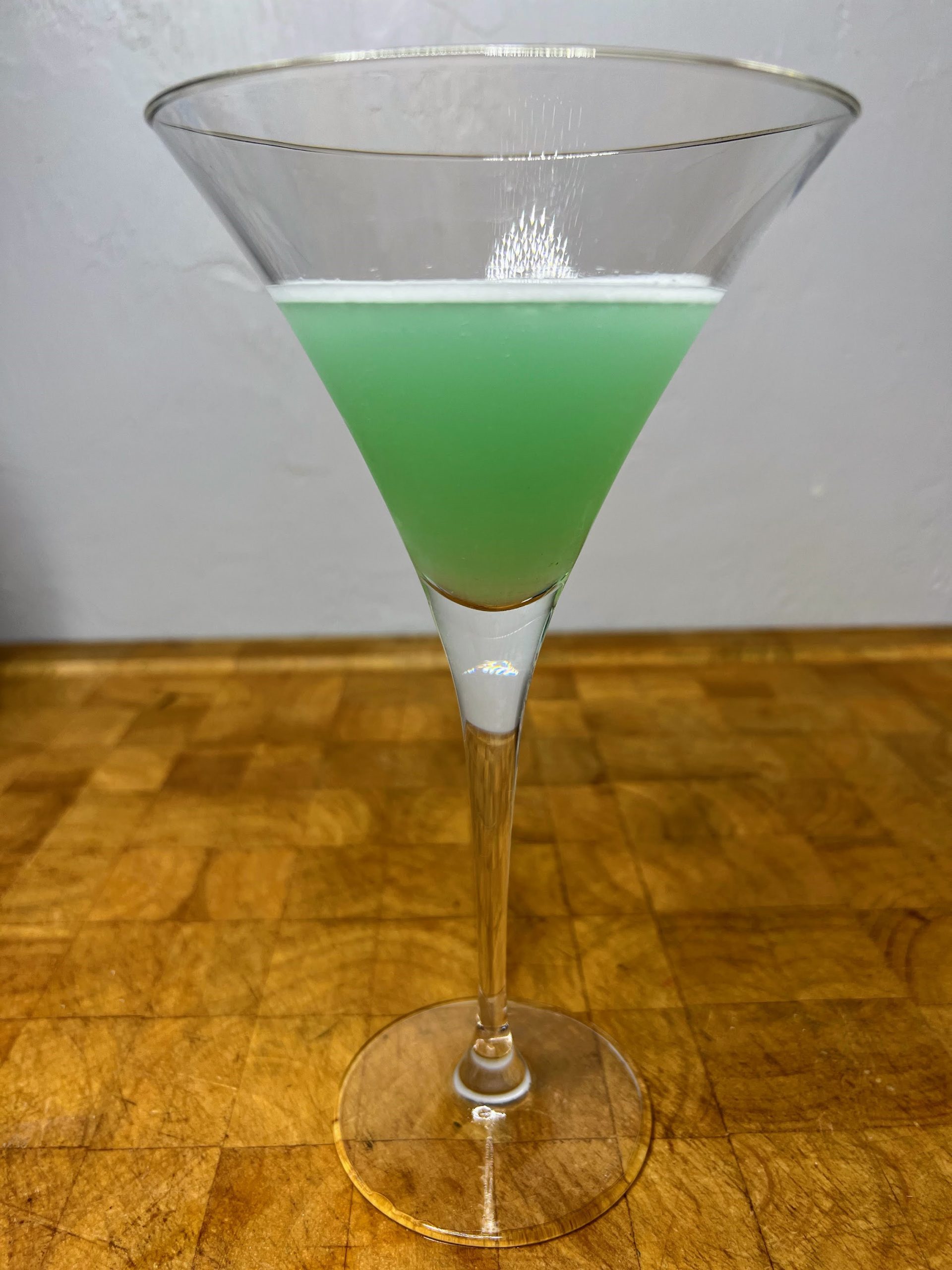 closeup of hypnotiq martini on a wooden table