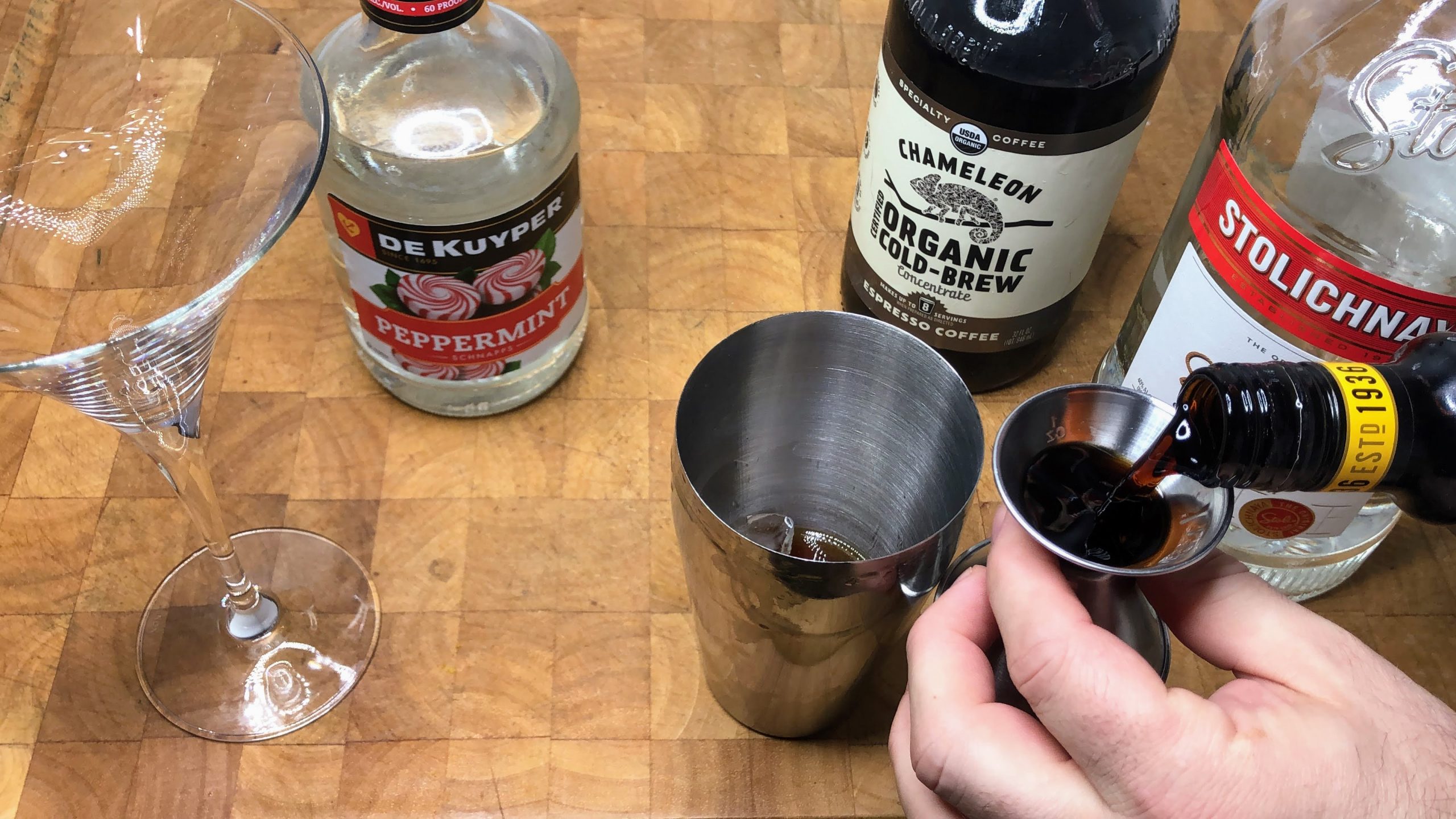 measuring our kahlua in a shaker