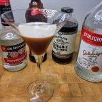 peppermint espresso martini surrounded by ingredient bottles