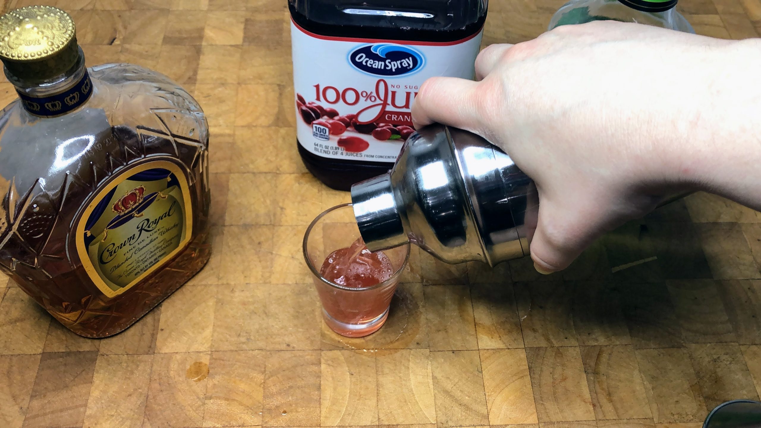 pouring washington apple shot into a glass