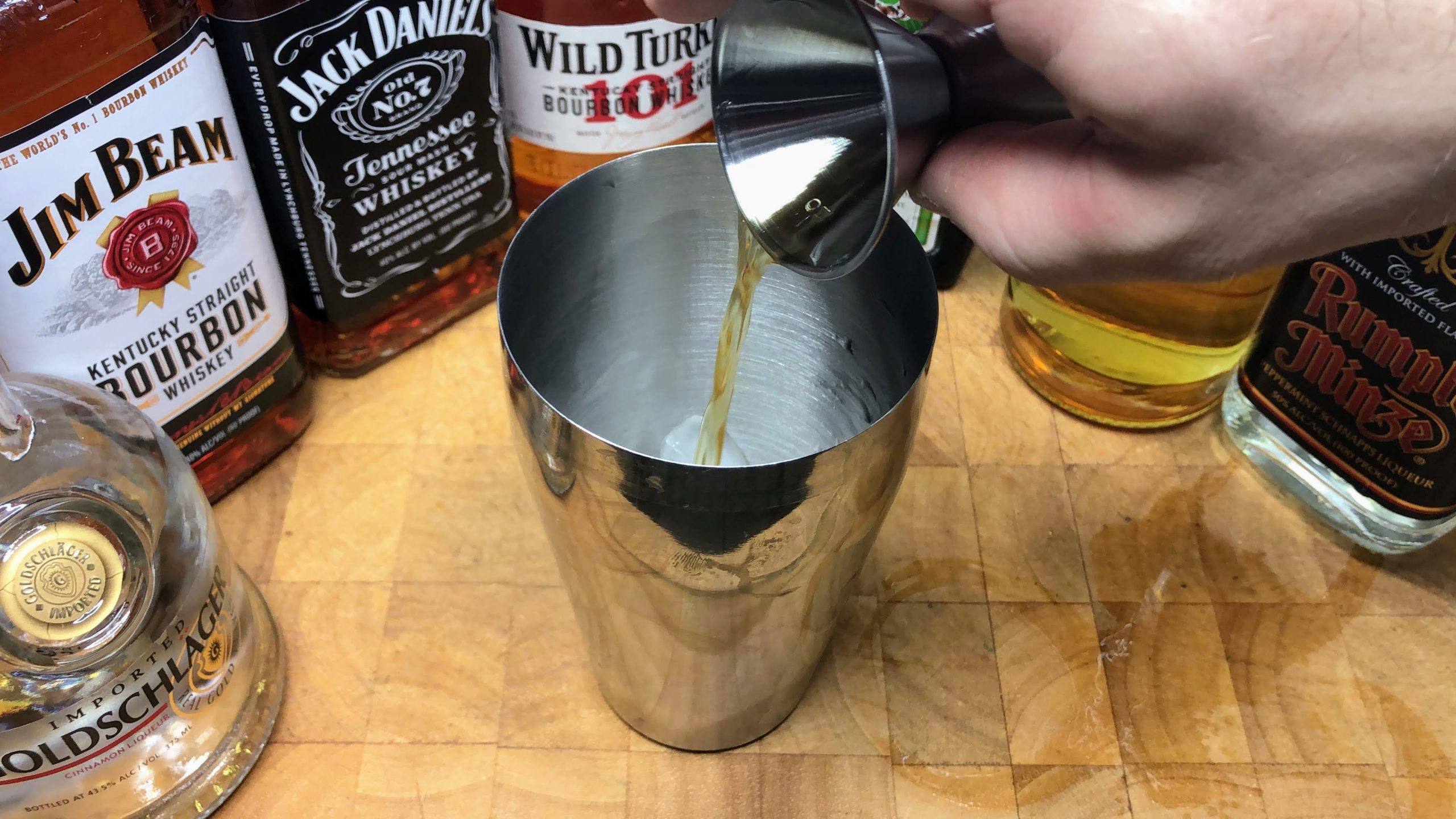 pouring wild turkey into a shaker