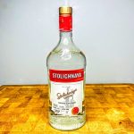 Bottle of vodka on a wooden table