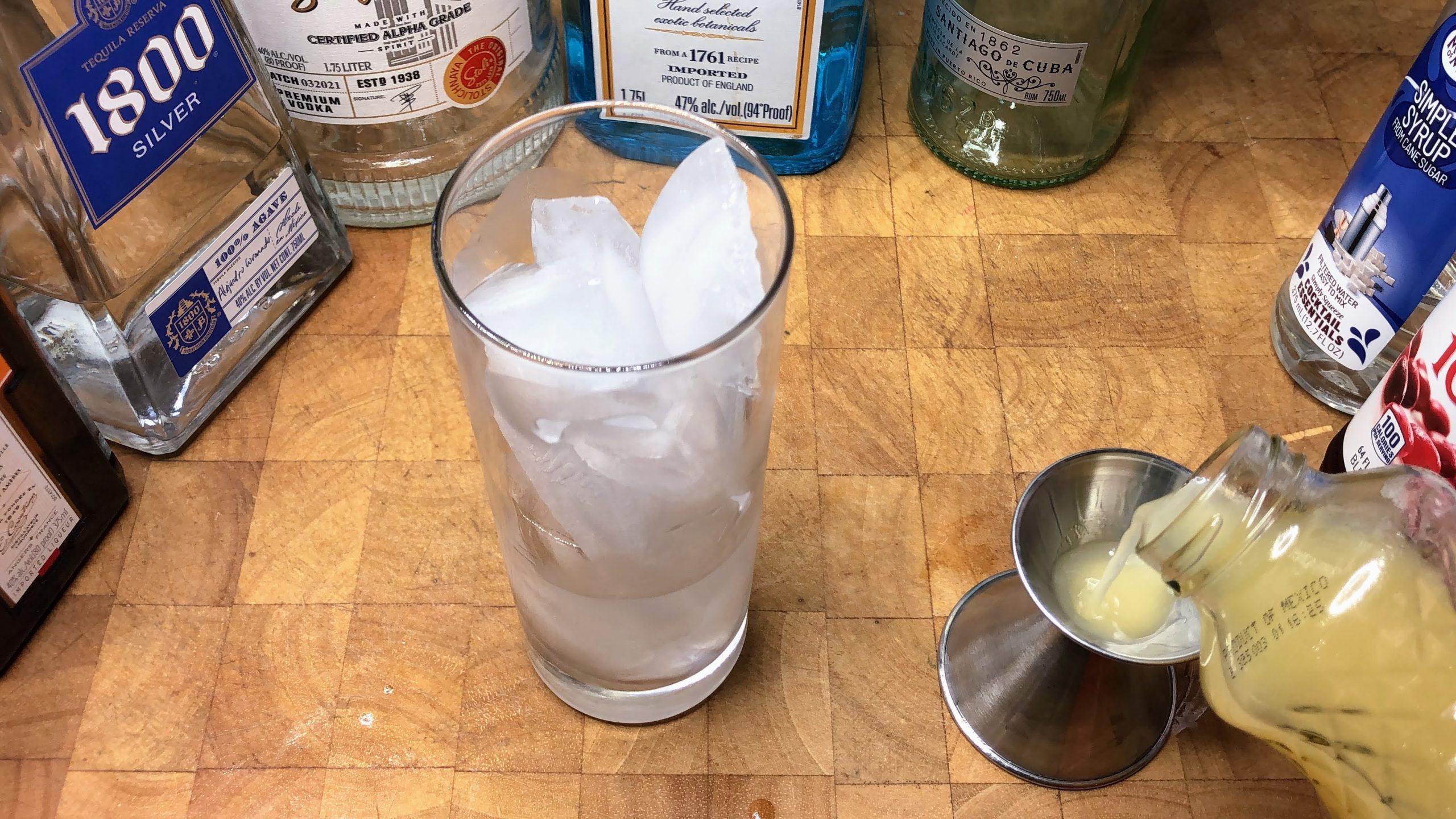Measuring lemon juice with a jigger.