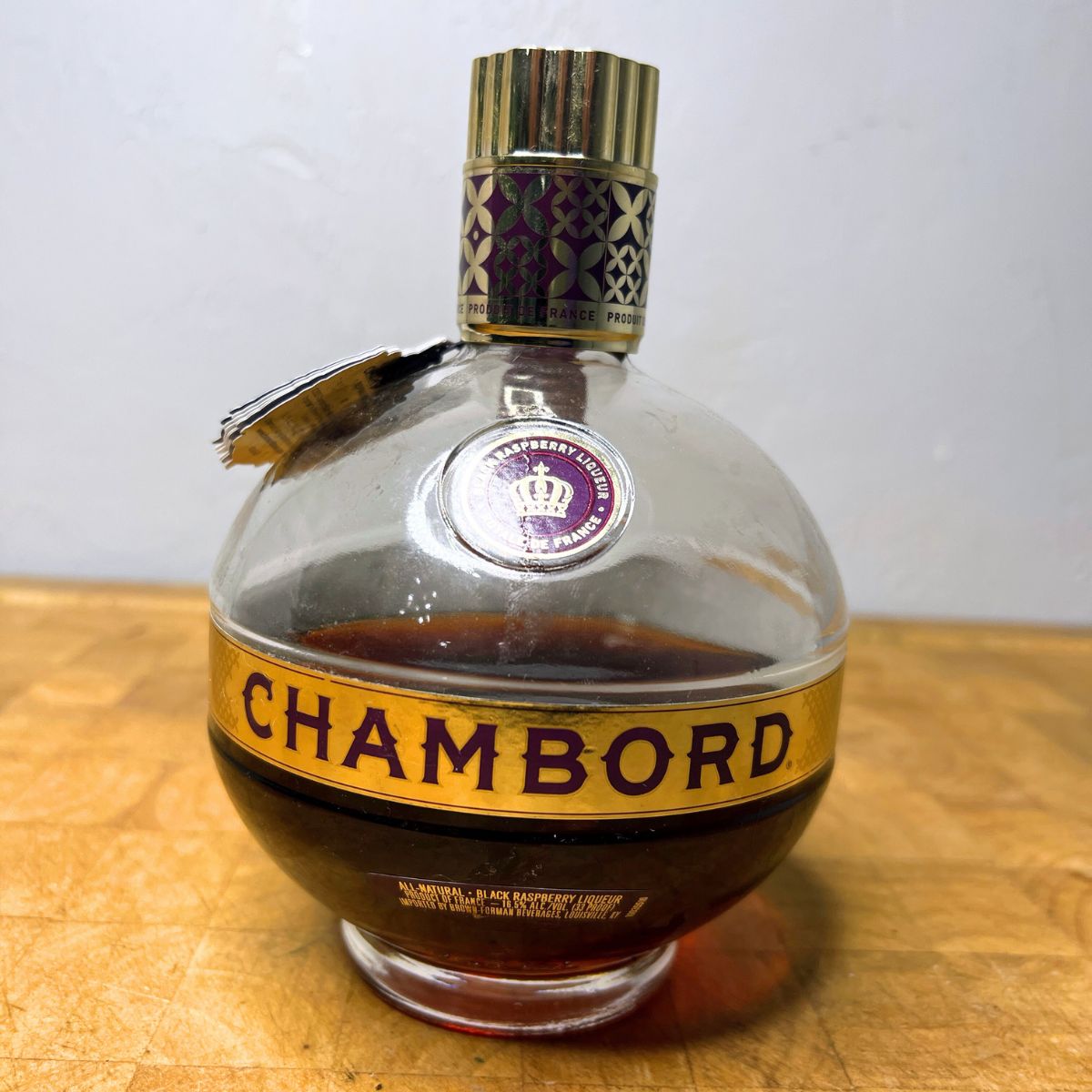 Bottle of Chambord on a table.