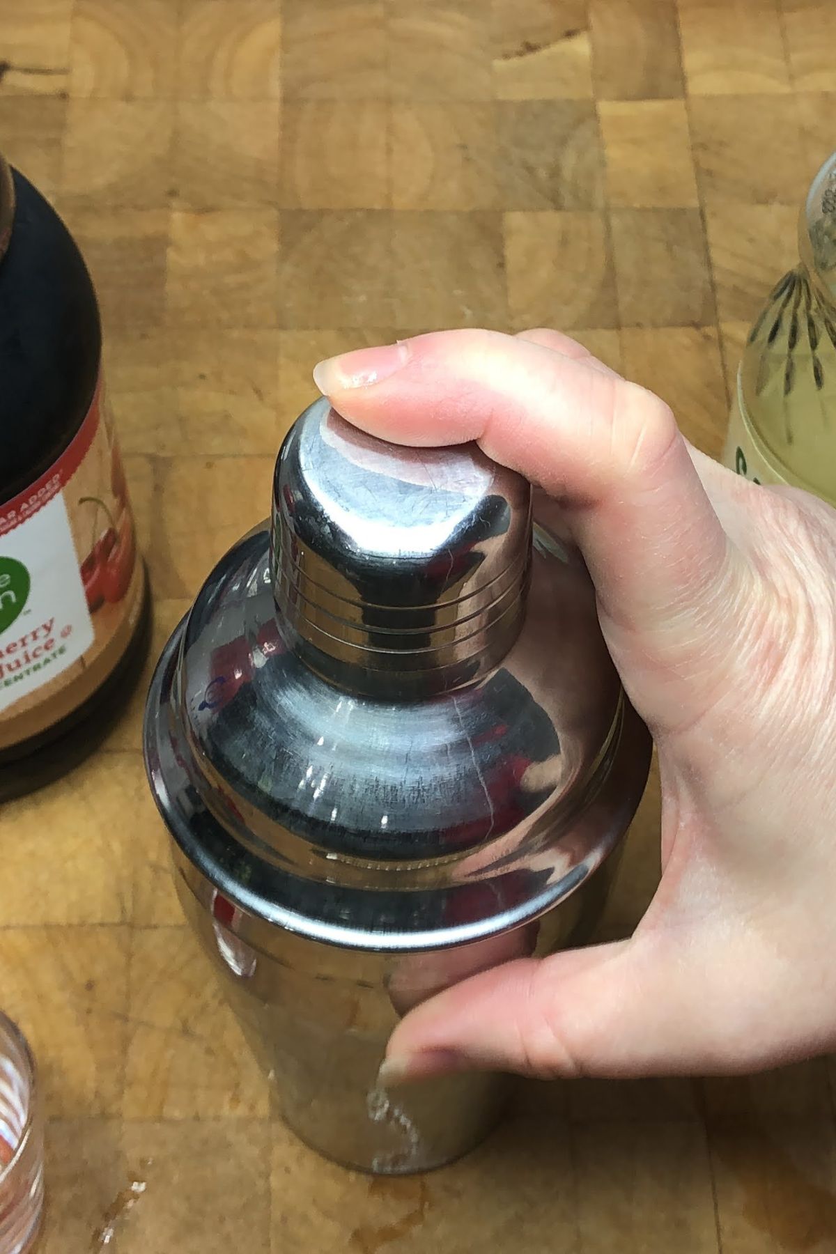 Covering the shaker with the lid.