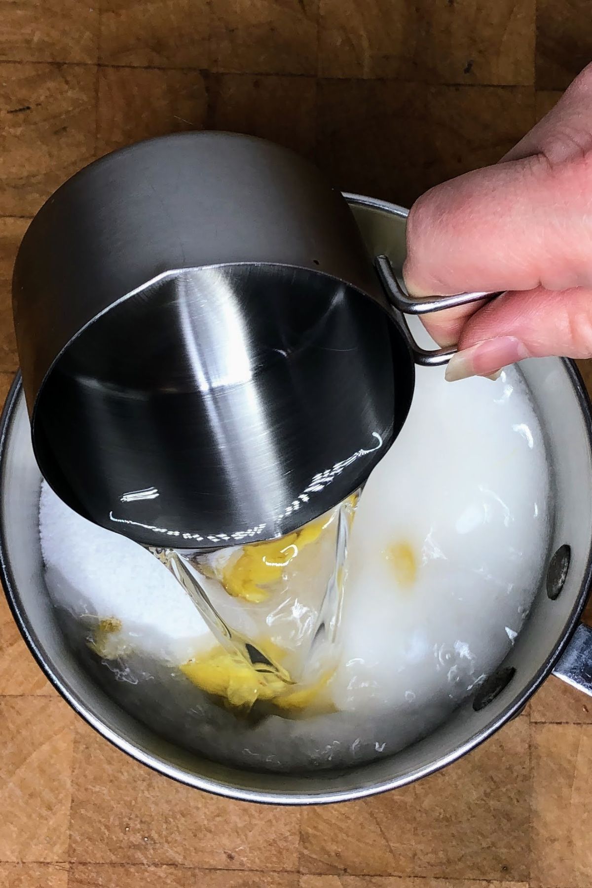 Pouring water into a pot.