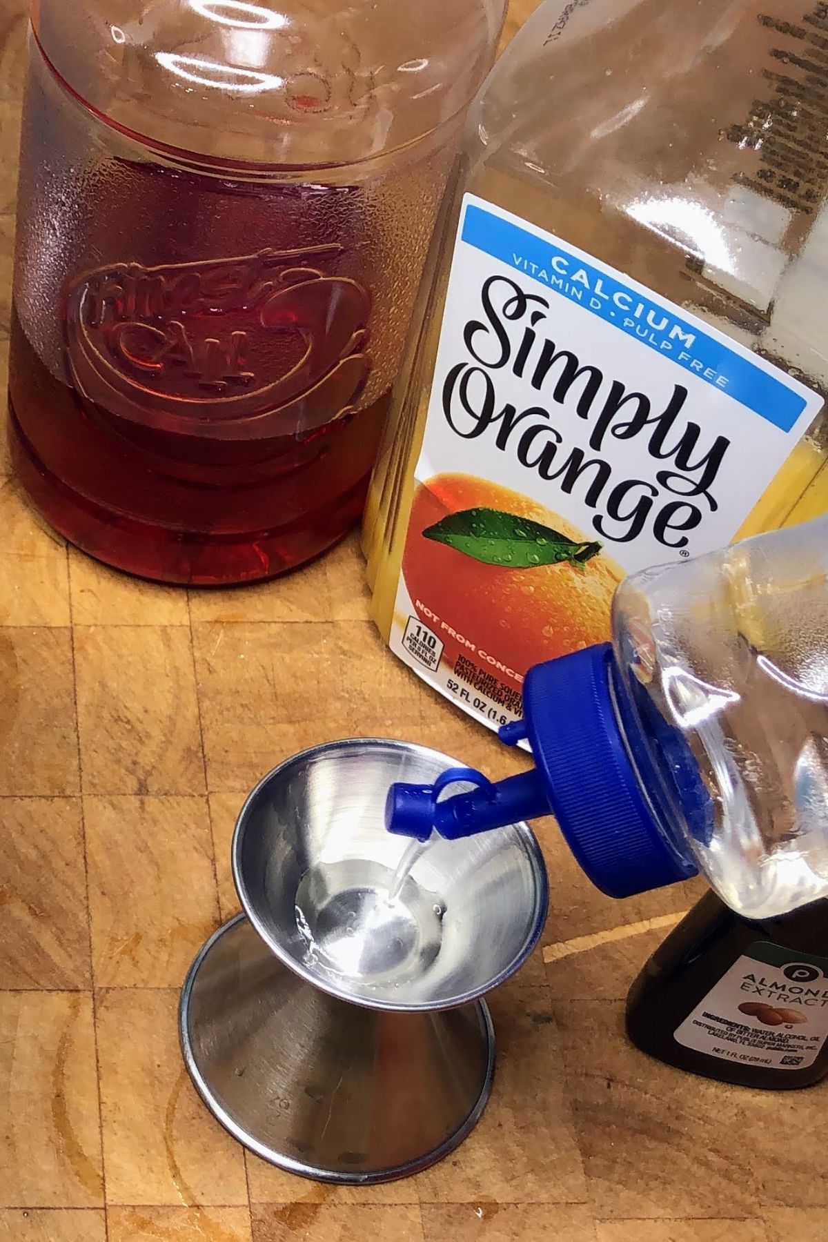 Measuring simple syrup in a jigger.