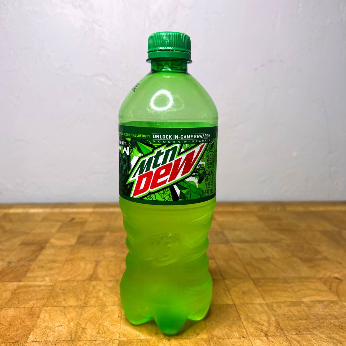Bottle of Mountain Dew on a table.