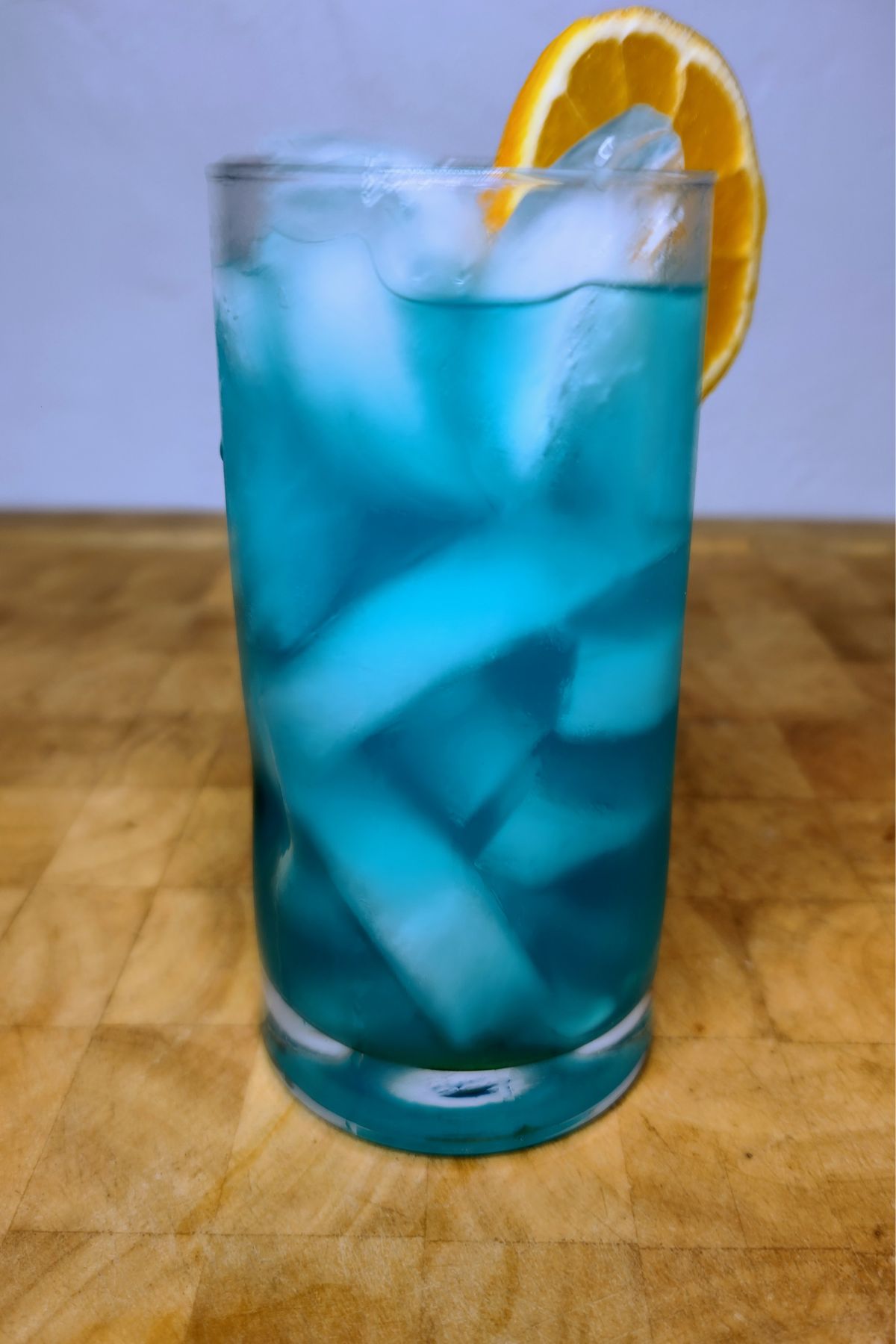 Blue motorcycle drink on a wooden table.