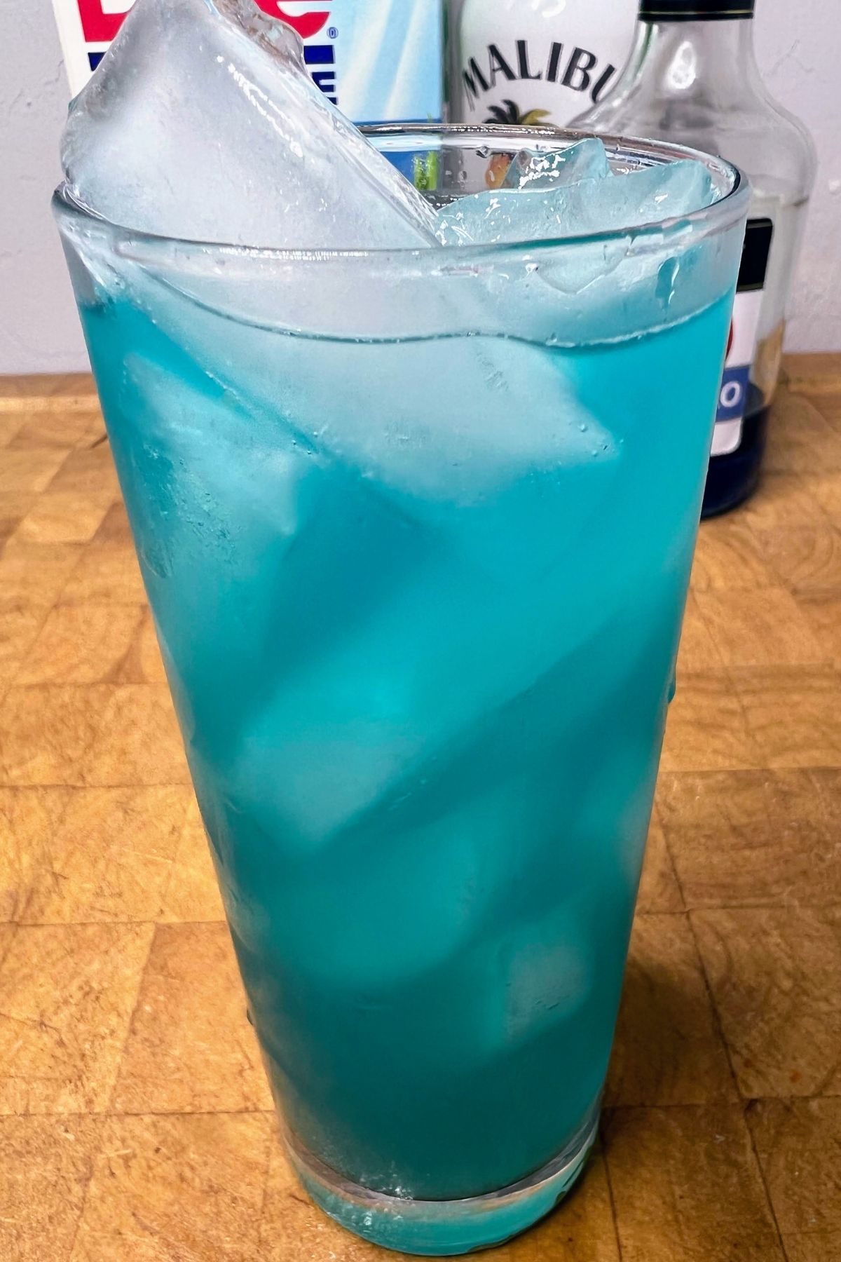 Electric smurf drink on a wooden table.