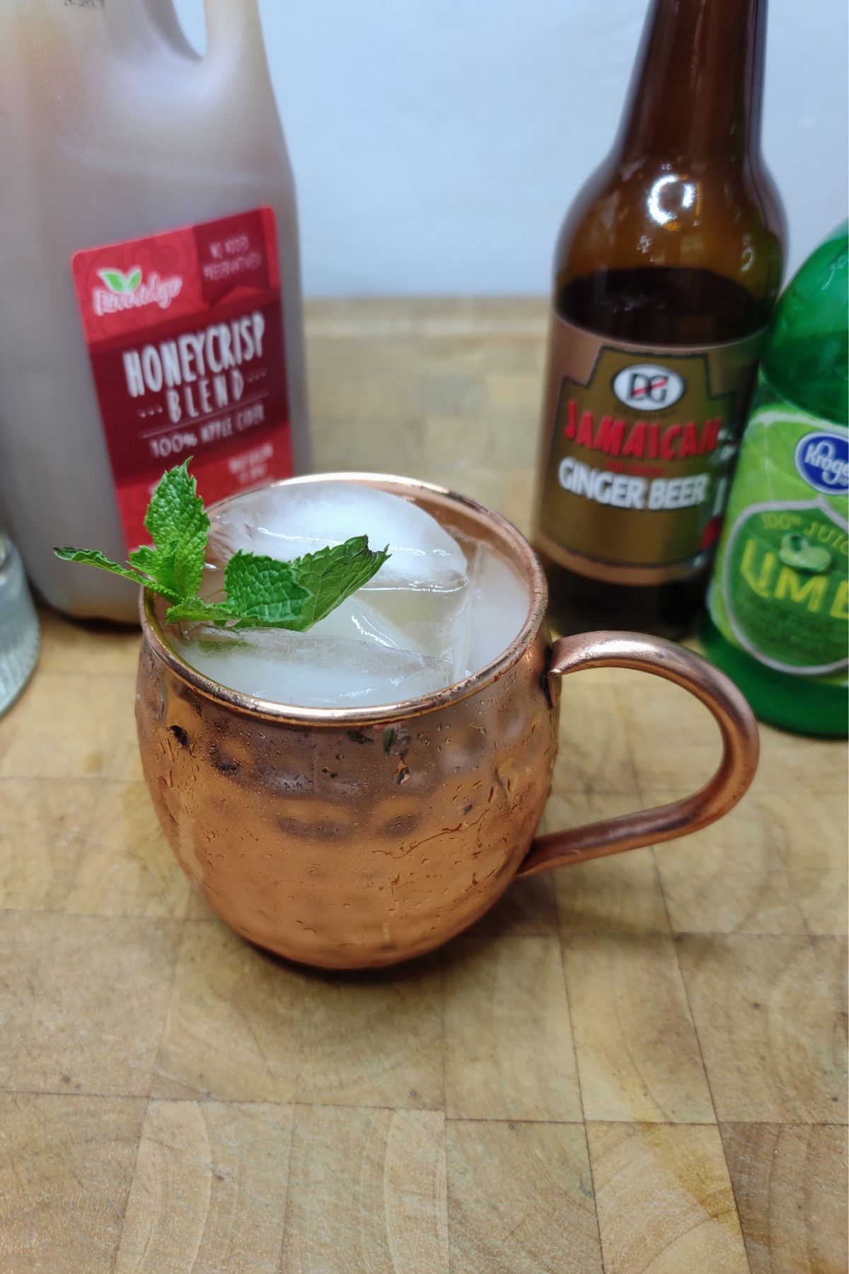 Apple cider mule on a wooden table.