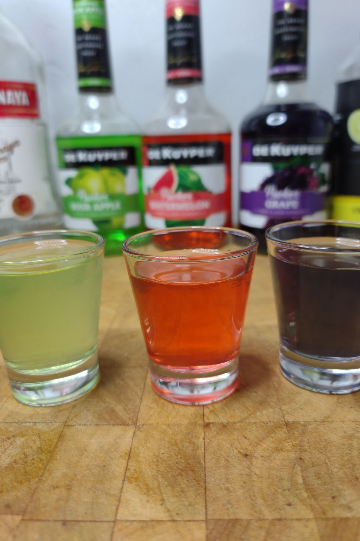 Jolly rancher shots on a wooden table.