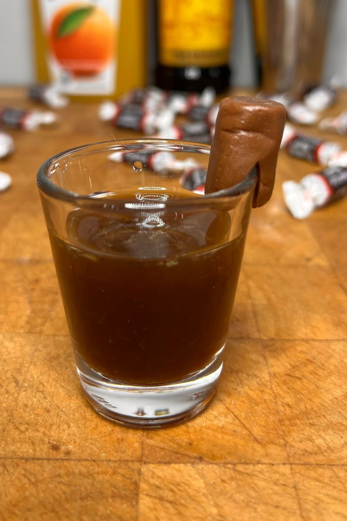 Tootsie roll shot on a wooden table.